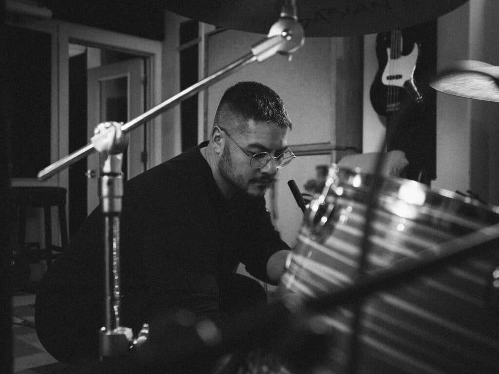 A black and white photo of Walt Jeworski in the studio.